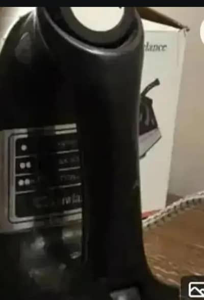 Great condition.  Black and silver coloured iron with box