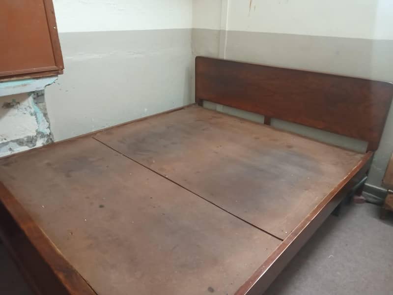 wooden bed . 1
