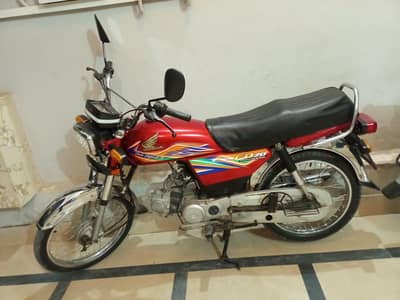 Honda cd70 20 model in red.