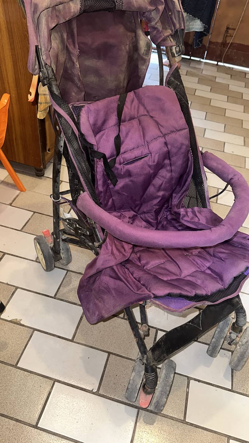 Purple stroller. 0