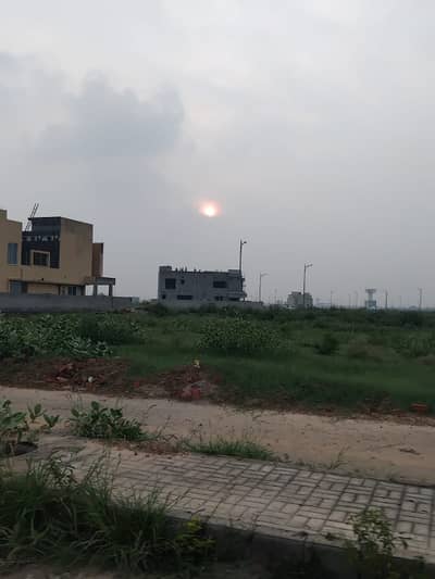 60 Ft Road 1 Kanal Plot No-301 Block G Top Location of Phase 9 Prism DHA Lahore For Urgent Sale