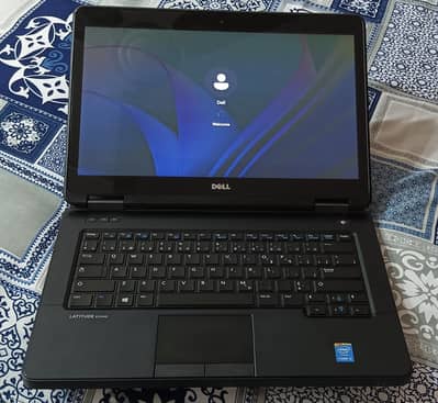 urgent Dell 5440 laptop for scale.