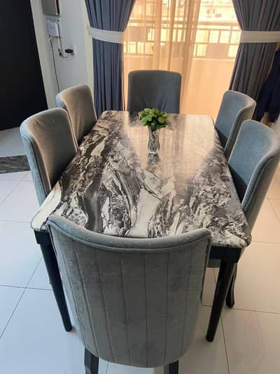 Sliightly used Marble Dining Table with 6 Cushioned Chairs