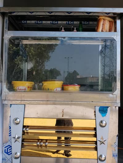 Burger and shawarma counter stand.