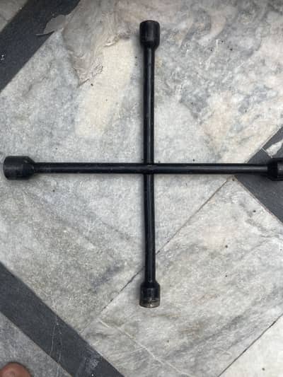 Cross wheel spanner