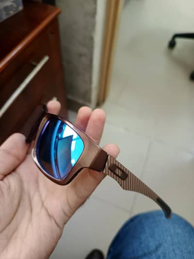 Oakley Jupiter Carbon sunglasses with a textured carbon-fiber