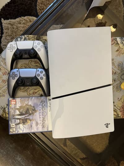 Ps5 slim disc edition with 2 controllers and God of war ragnarok