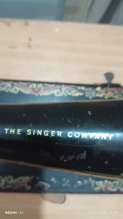 singer sewing machine and original singer pandel stand