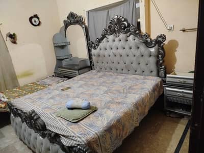 double bed with side tables and dressing table