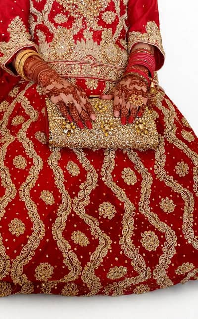 Traditional Red Bridal lehnga heavy Gold embroidery premium fabric .