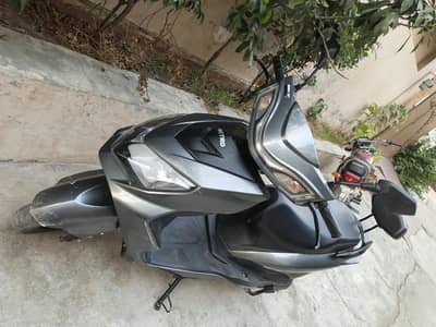 Metro Thrill Electric Scooter (E-bike) in a silver-gray color finish.