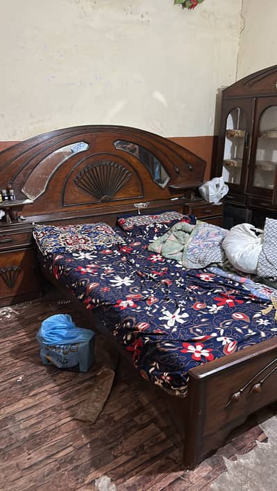 One double bed with two side tables and one showcase