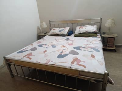 Bed and side tables without mattress