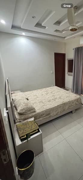 bed with side table hanging mirror and computer table 0