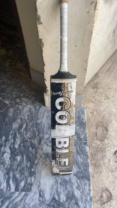 Cobble bat made from coconut wood with some minor scratches