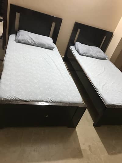 Wooden single bed with mattress