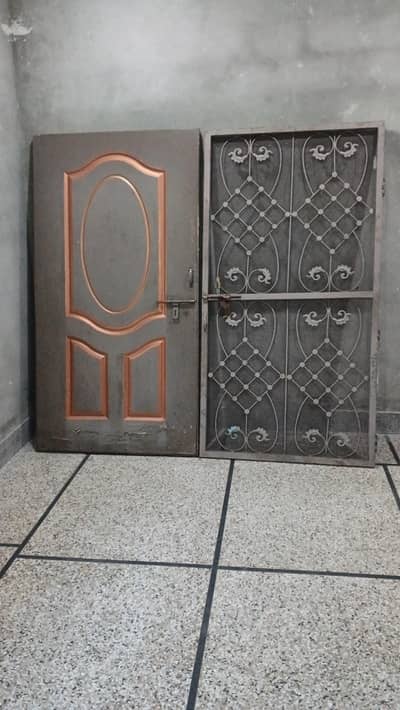 2 plywood doors and 2 iron grills are available for sale