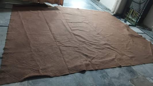 brown large carpet with design in it singke layer