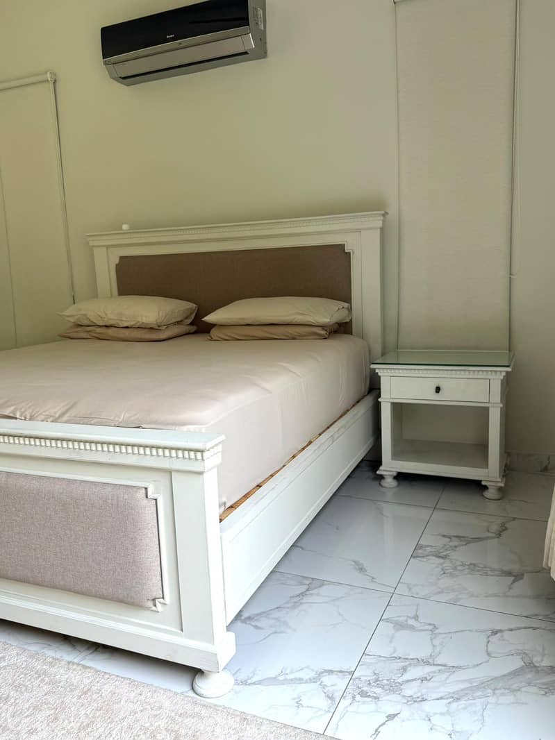 Solid wood , king size bed with two side tables. 0
