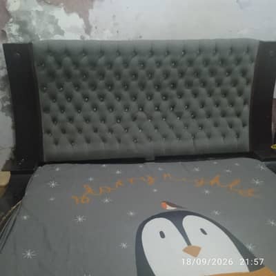 king size wooden bed in good condition with mattress without cover