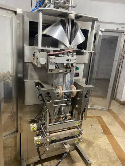 Automatic Liquid Packing Machine | Pouch Filling & Sealing Machine