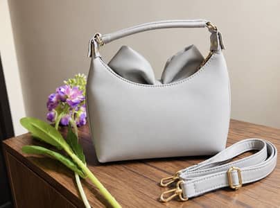 Elegant Grey Bow Handbag with Gold Hardware 