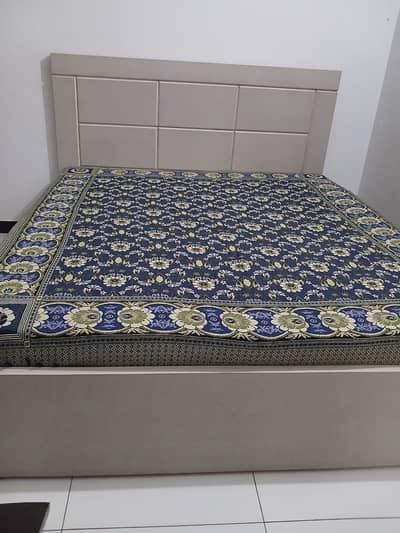 bed with mattress and wardrobe