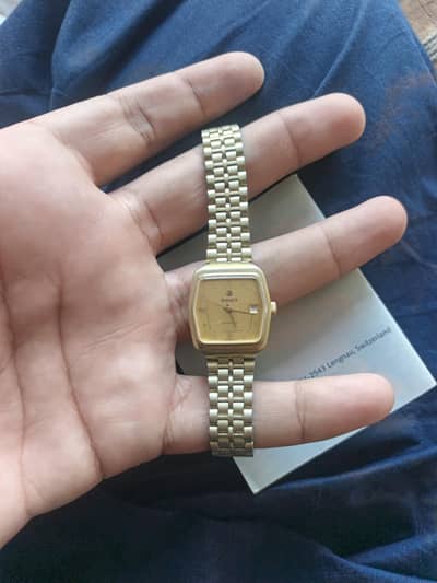 rado gold watch