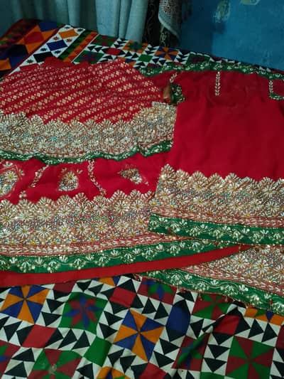 *1. Heavy Red Bridal Lehenga - 1 Time Used - Moti Work  ۔