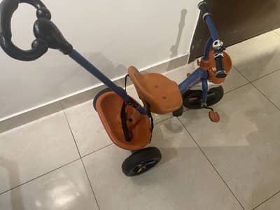 Tricycle and car