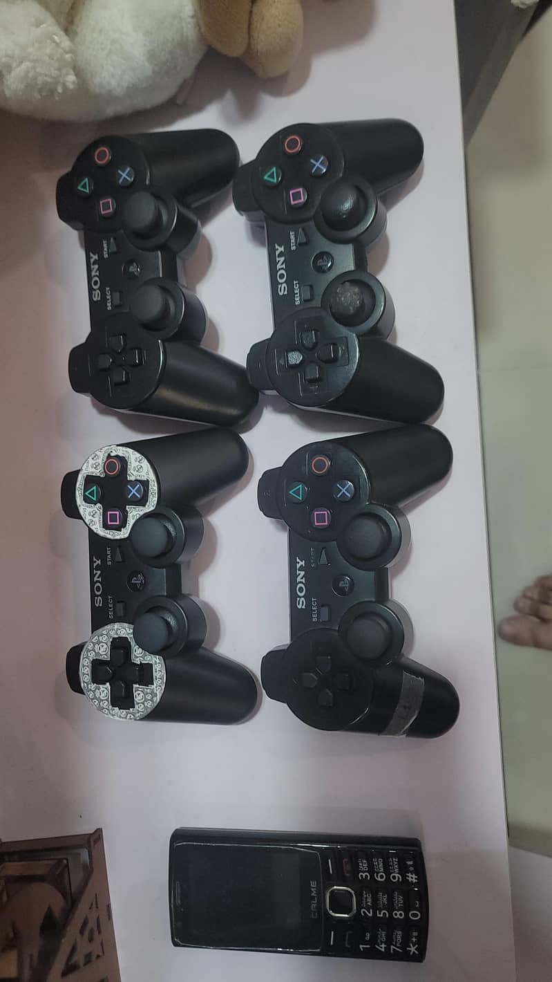 PS3 SLIM WITH FOUR CONTROLLER 7