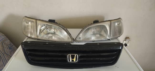 honda city 2000 front black grill and headlight both