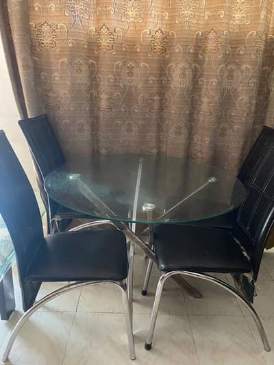 glass top dining table and four chair also
