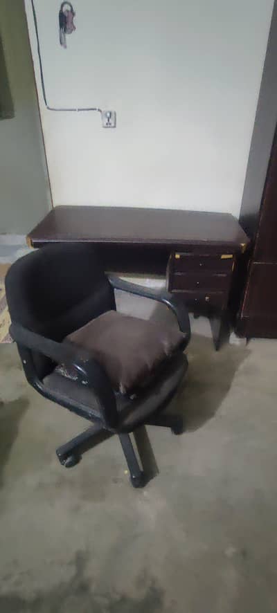 Office table with revolving chair
