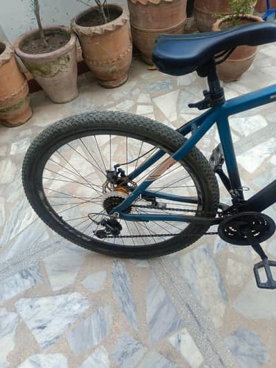 Two cycles for 40k -26 inch Mountain bike with small pink bike