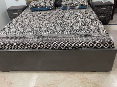 King size bed with side table