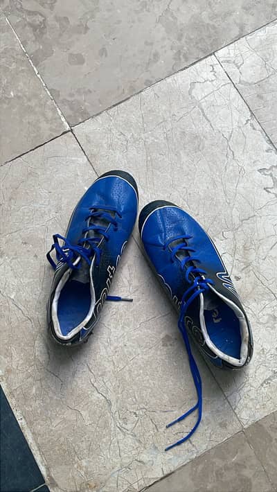 Studs football shoes