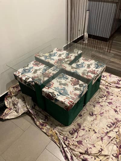 space saving dining table with puffies.