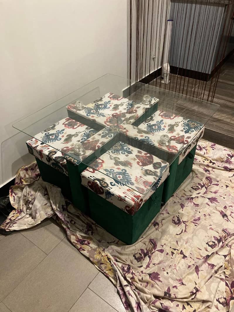 space saving dining table with puffies. 0