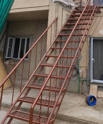 SLIGHTLY USED STEEL LADDER FOR SALE
