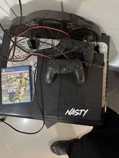 Playstation 4 Fat (500) GB with two controllers and two game CD