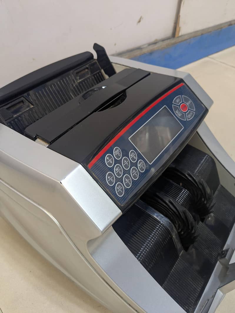 CASH COUNTING AND CHECKING MACHINE 2