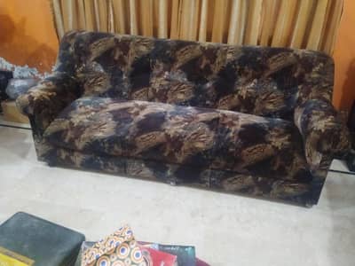 brown and black colour sofa