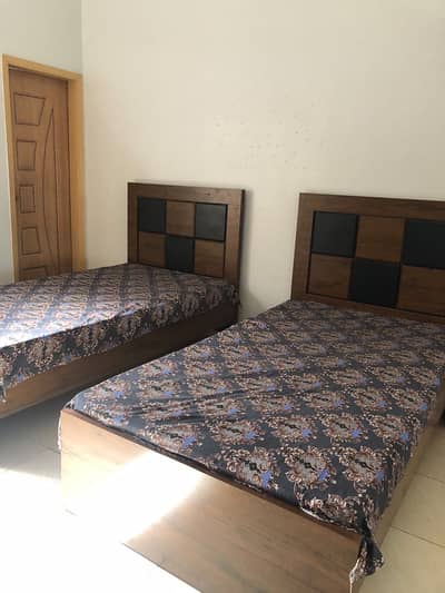 2 wooden single beds for urgent sell