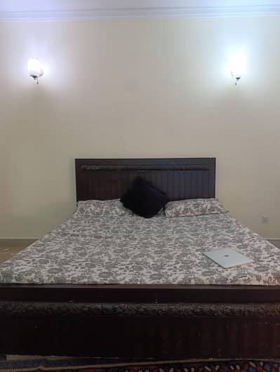 dark brown wooden bed