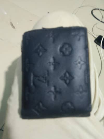 black embossed Louis Vuitton monogram leather wallet
