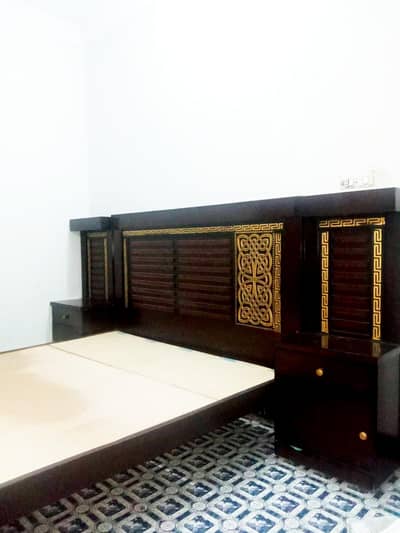 New king size bed along with two side tables , dressing table and foam