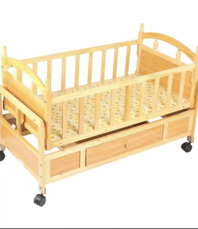 A baby wooden bed for sale . .