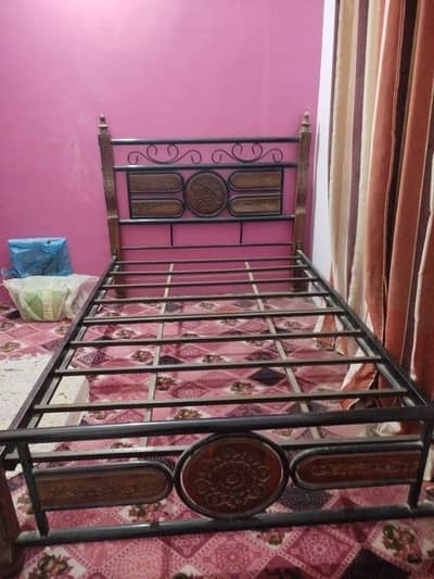 It is wood and iron bed not much used