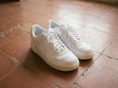 imported thrift shoes plain white sneakers Nike Air Force style 9/10